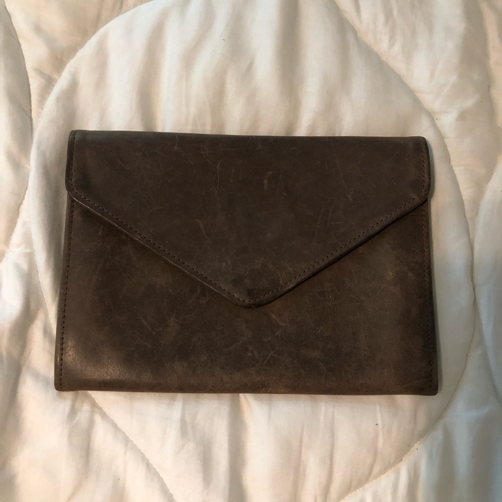 Able leather clutch in great shape. Perfect size for night out or travel.